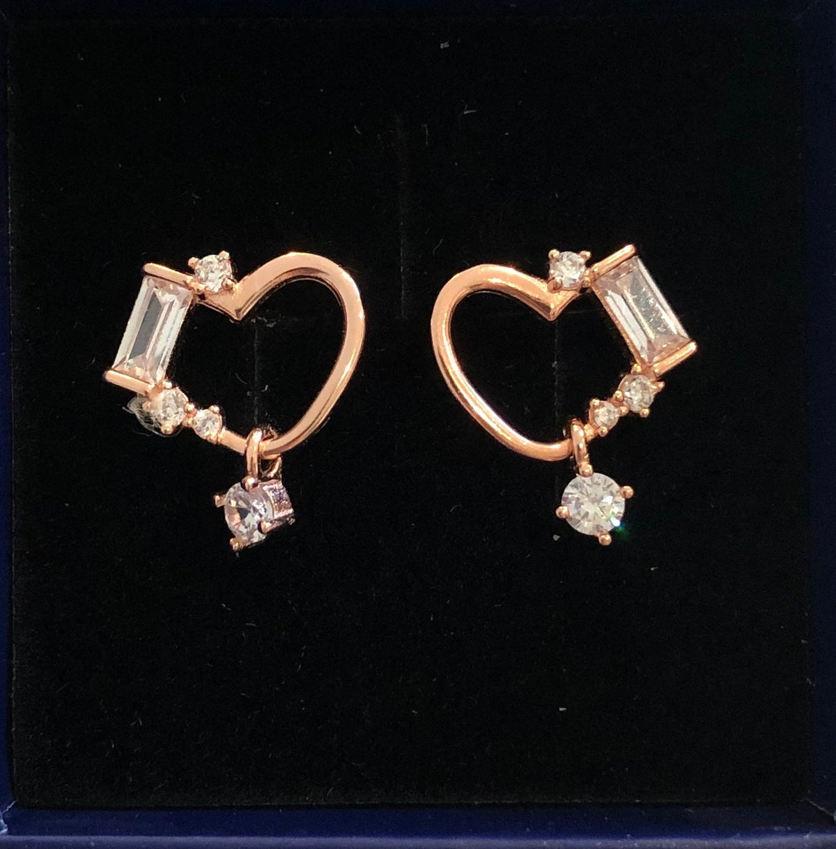 Heart shaped stud with princess cut stones