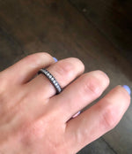 Sandwich ring with pave-set clear zircon stones